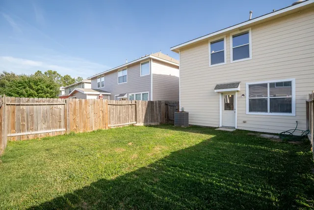 a view of a backyard of the house