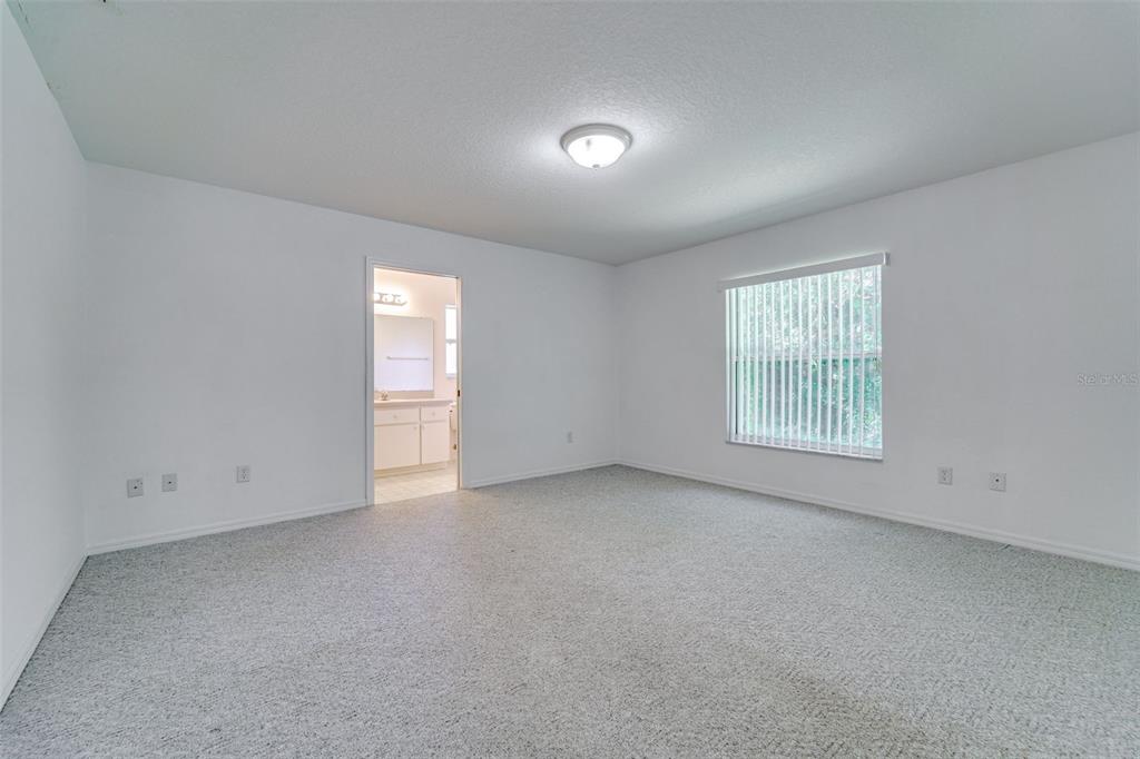 729 Longfellow Terrace Inverness, FL 34450 - Photo 17 of 37 an empty room with windows