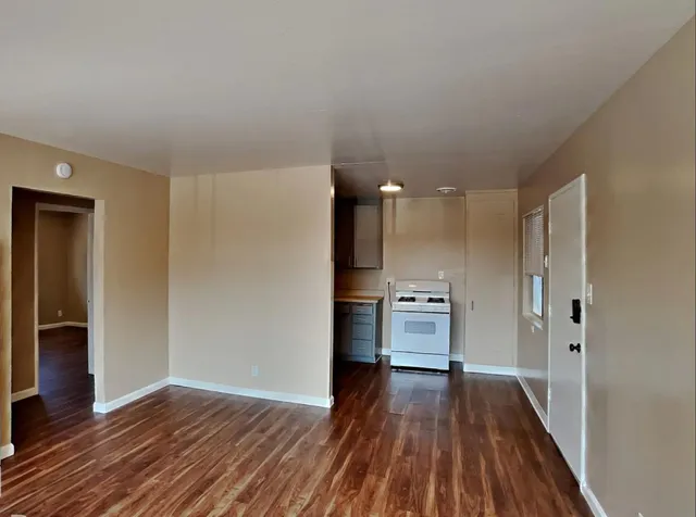 a bathroom with a white bath tub sitting next to a white sink and vanity