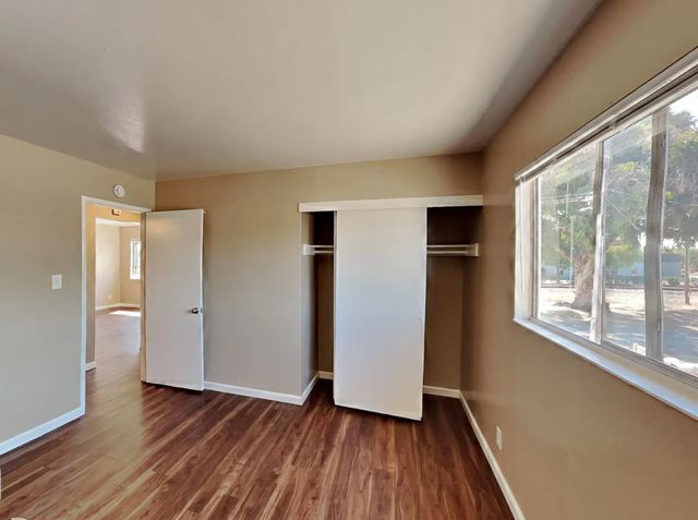 a view of a cars park in front of a building