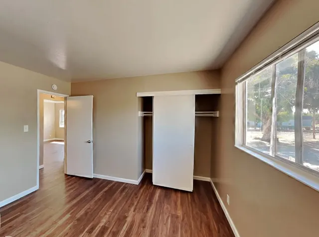 a view of a cars park in front of a building