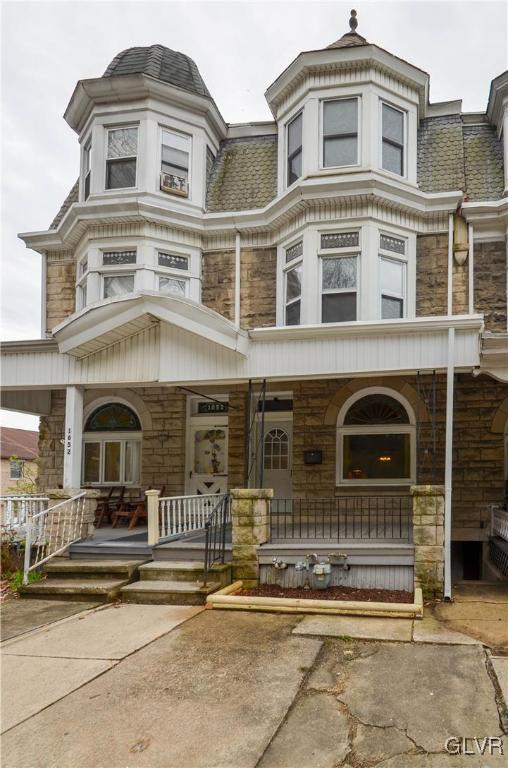a front view of a house with a porch