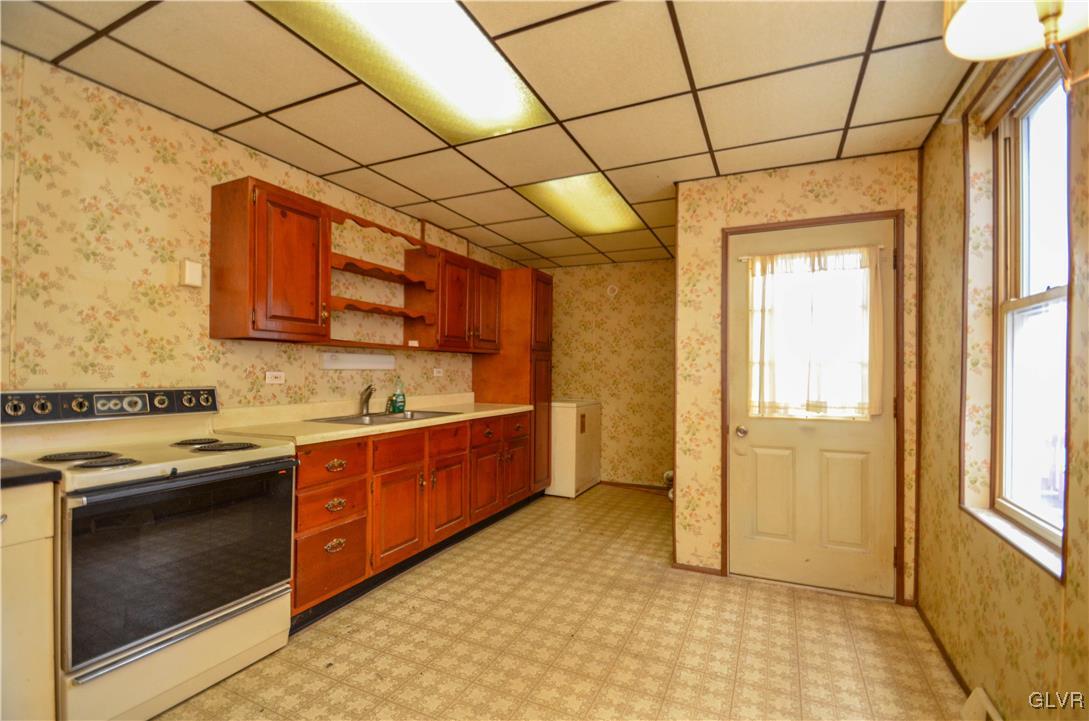 1650 Mineral Spring Road Reading, PA 19602 - Photo 5 of 26 a kitchen with stainless steel appliances granite countertop a stove a sink and a refrigerator