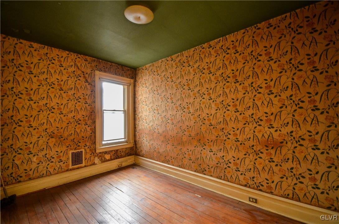 1650 Mineral Spring Road Reading, PA 19602 - Photo 9 of 26 a view of empty room with wooden floor and fan