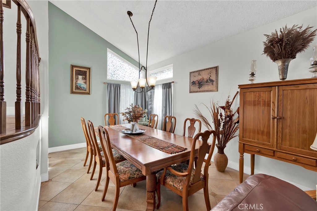 3350 May Court Riverside, CA 92503 - Photo 32 of 55 a view of a dining room with furniture and a chandelier