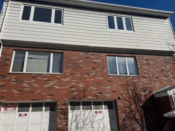 a view of house with large windows