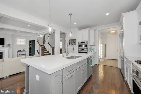 a view of a living room and wooden floor