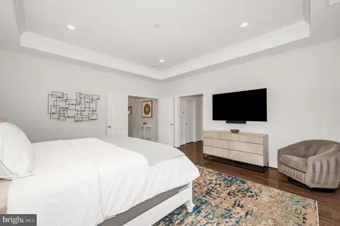 a bedroom with a bed and cabinets
