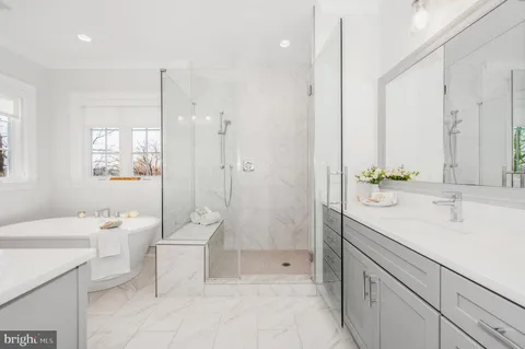 a bathroom with a sink double vanity and a mirror