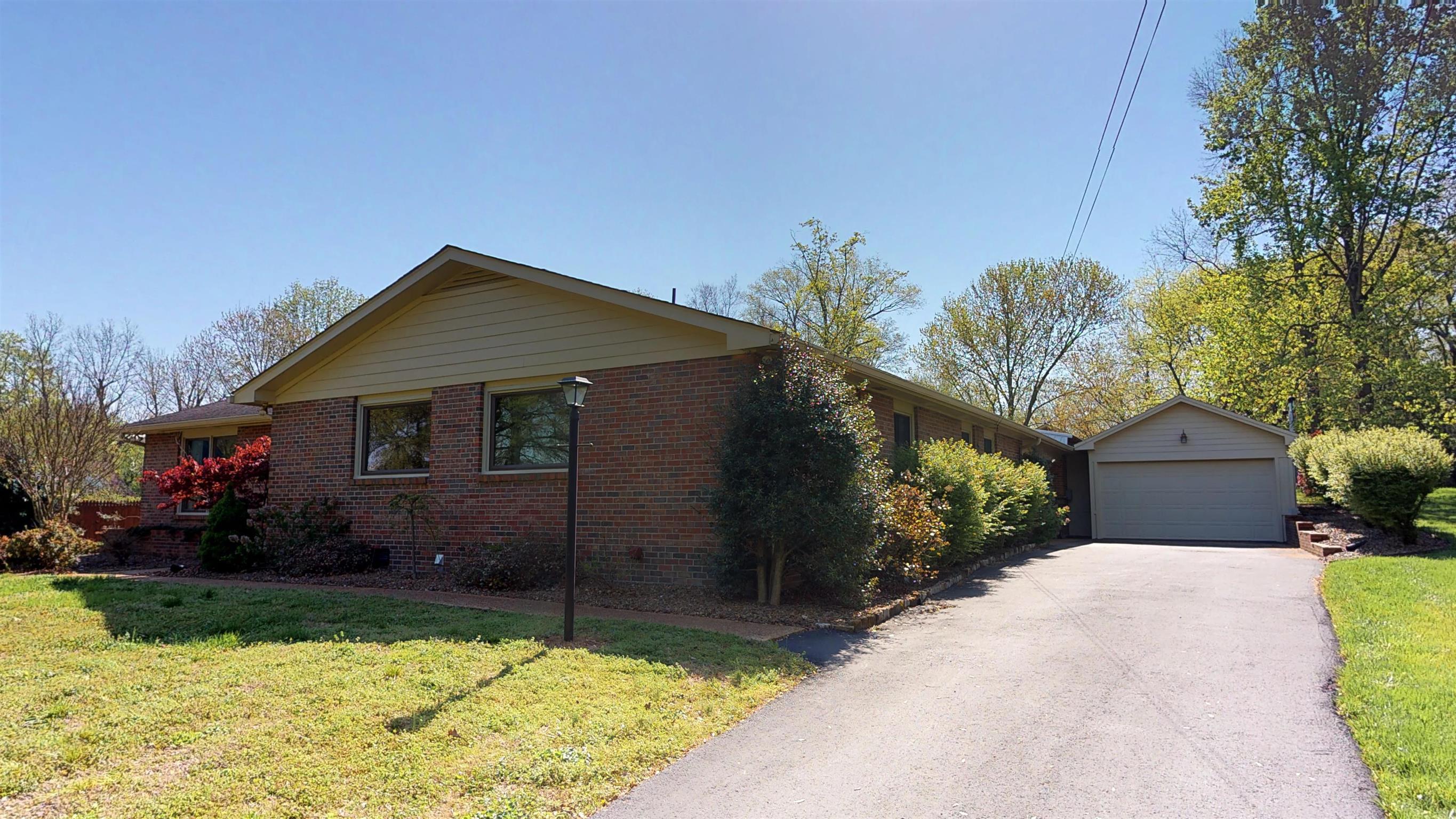 111 Spring Valley Road Nashville, TN 37214 - Photo 2 of 29 a front view of a house with garden