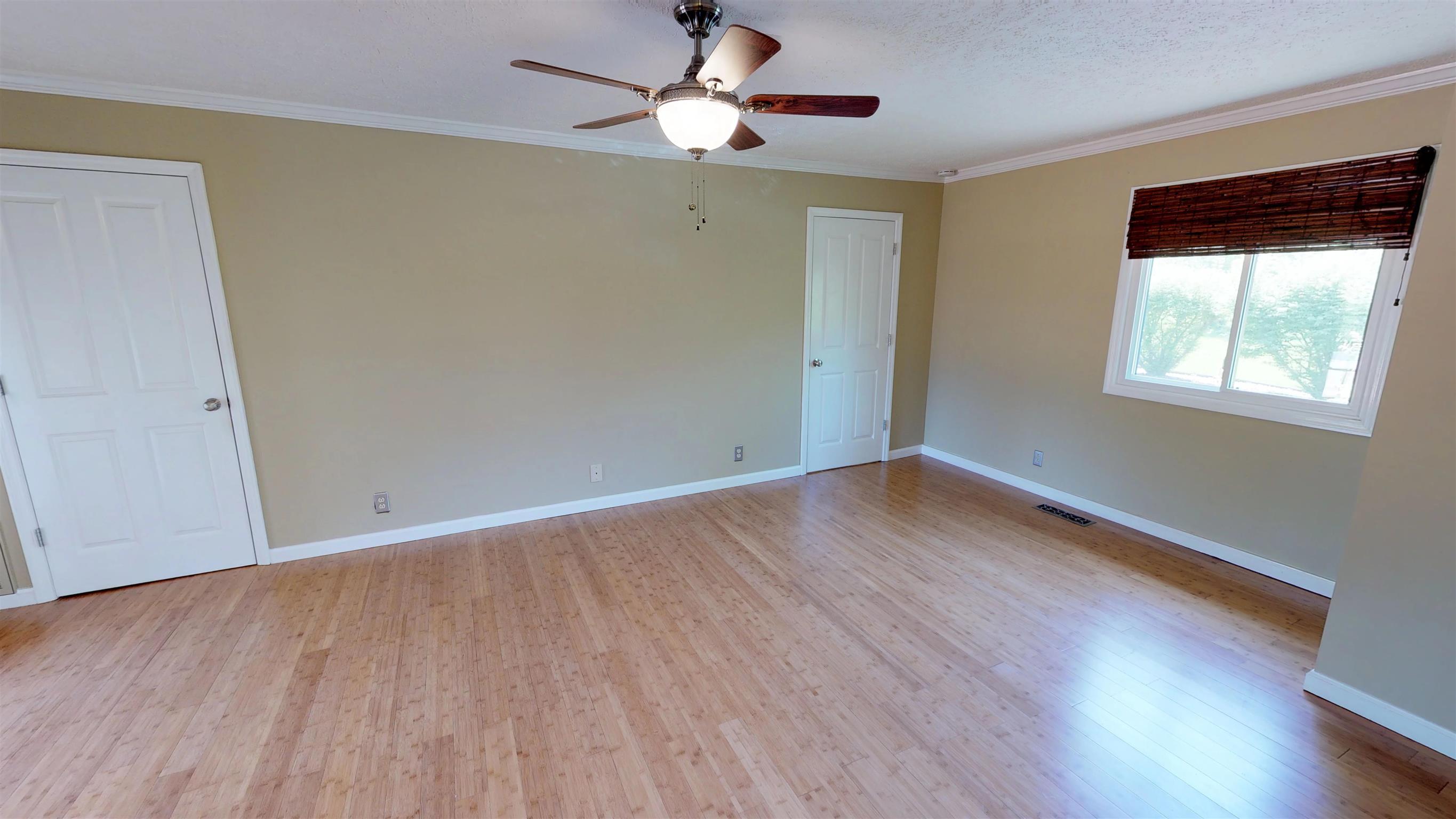 111 Spring Valley Road Nashville, TN 37214 - Photo 14 of 29 a view of empty room with wooden floor and fan