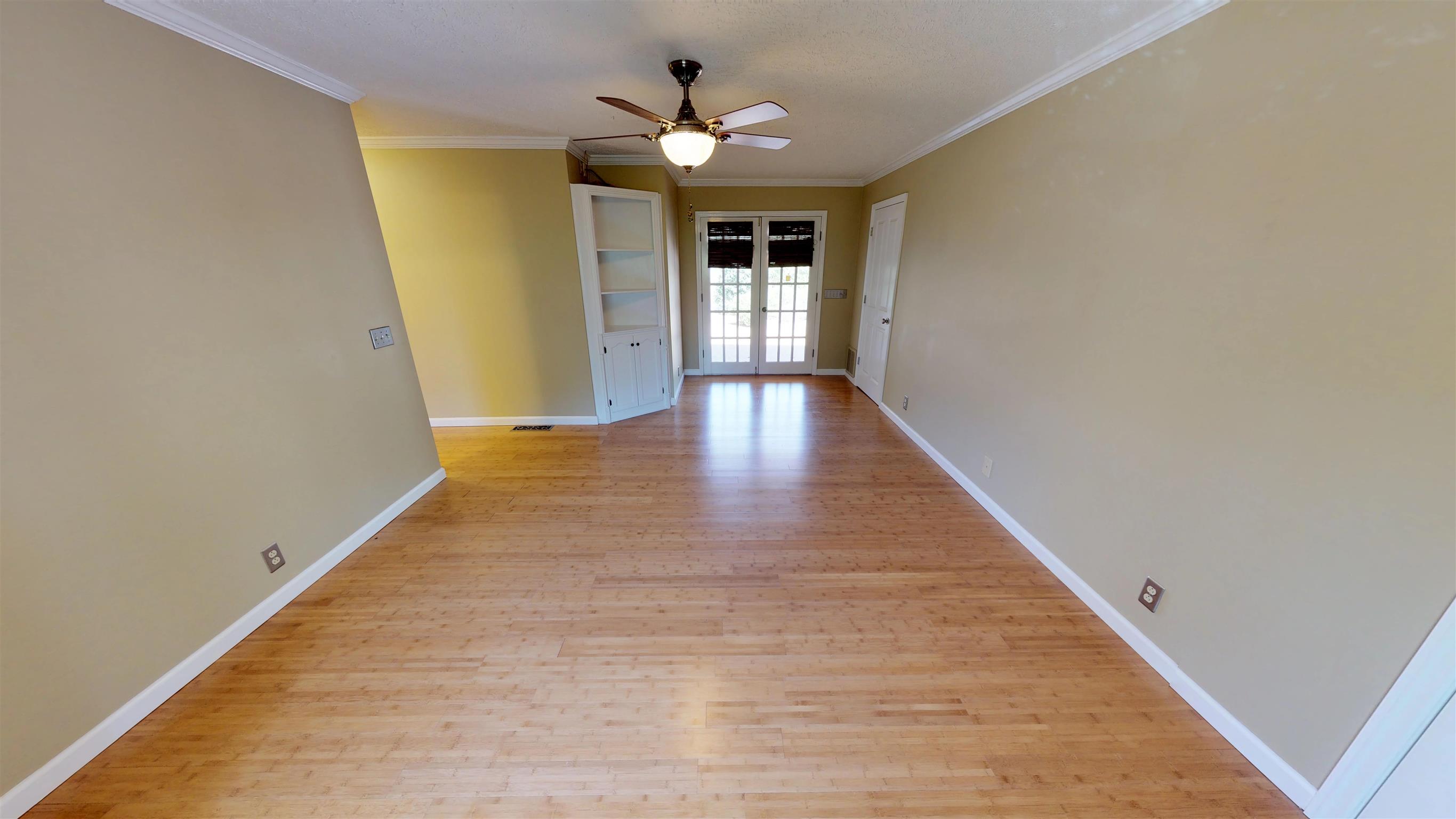 111 Spring Valley Road Nashville, TN 37214 - Photo 15 of 29 wooden floor in an empty room with a window