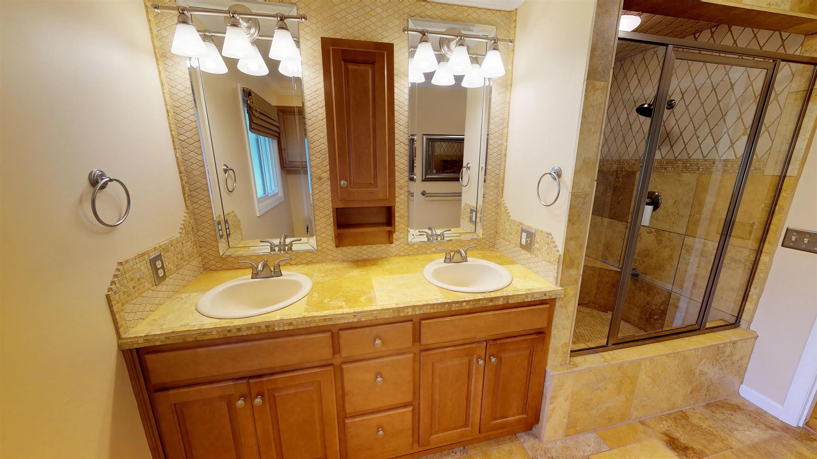 111 Spring Valley Road Nashville, TN 37214 - Photo 16 of 29 a bathroom with a granite countertop sink and a mirror