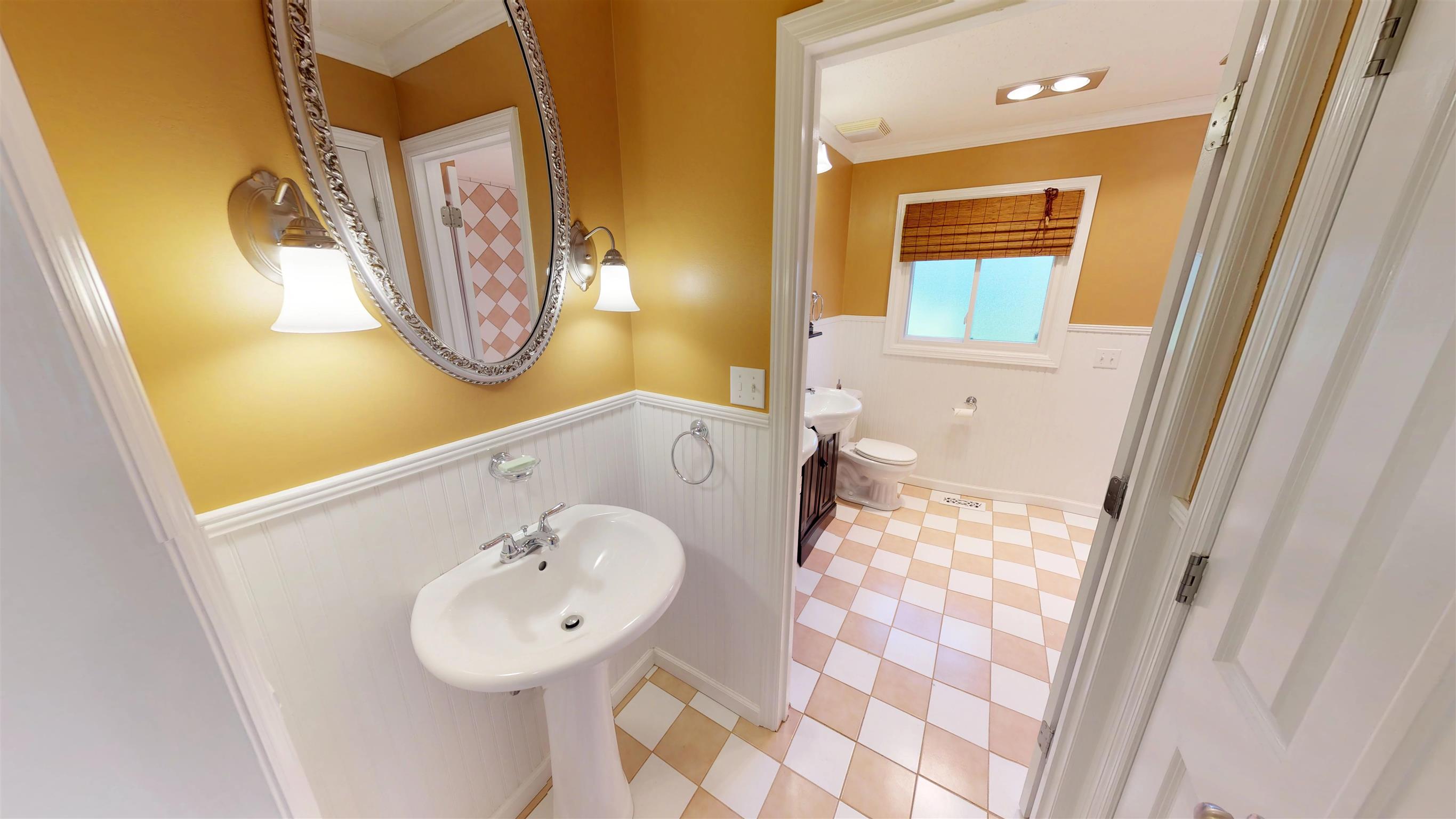 111 Spring Valley Road Nashville, TN 37214 - Photo 18 of 29 a bathroom with a sink and a mirror