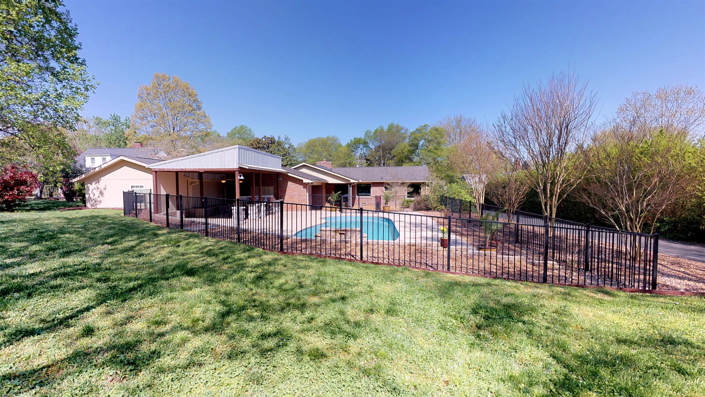 111 Spring Valley Road Nashville, TN 37214 - Photo 25 of 29 a view of a house with a yard and sitting area