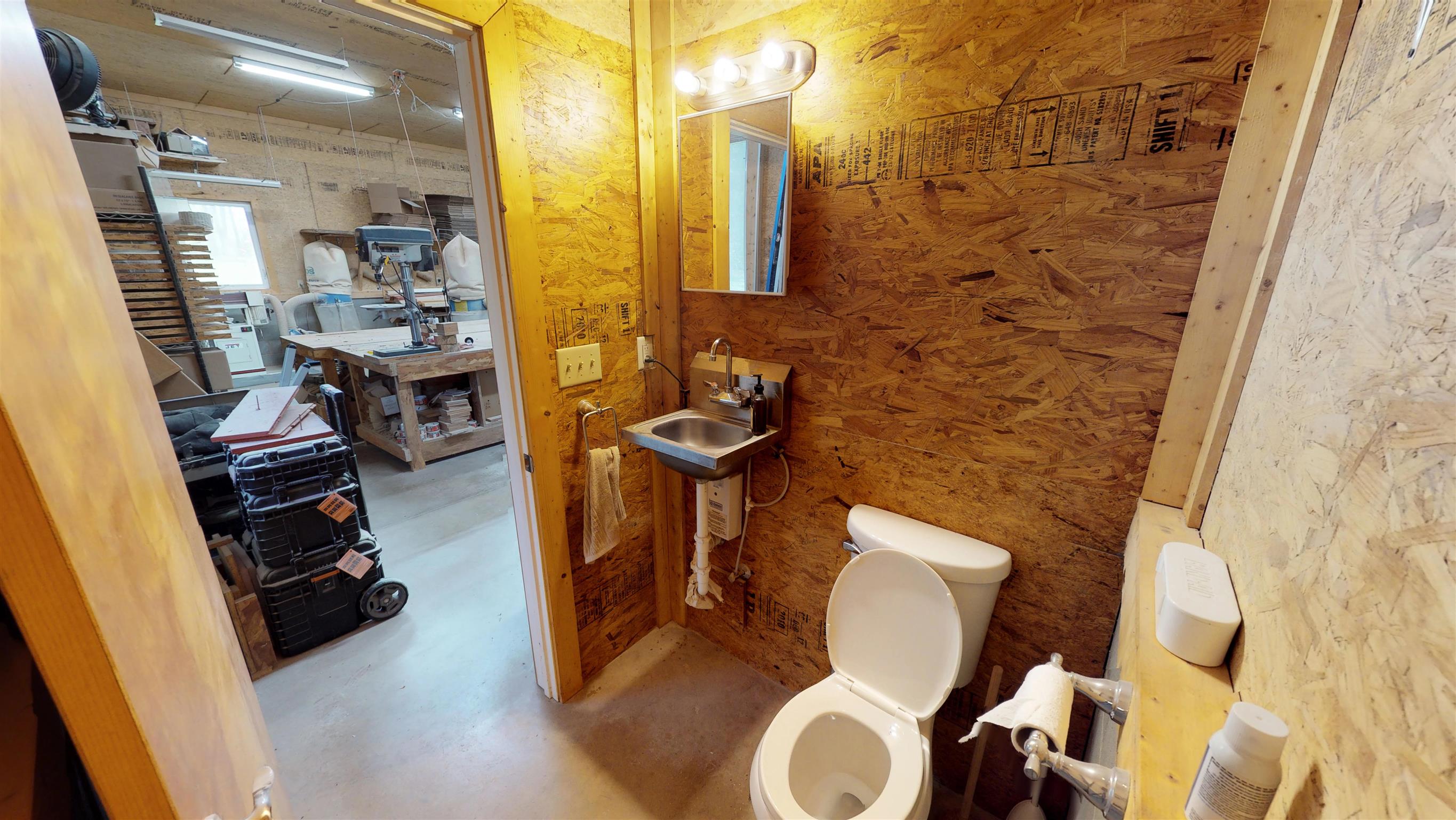 111 Spring Valley Road Nashville, TN 37214 - Photo 28 of 29 a bathroom with a toilet and a mirror