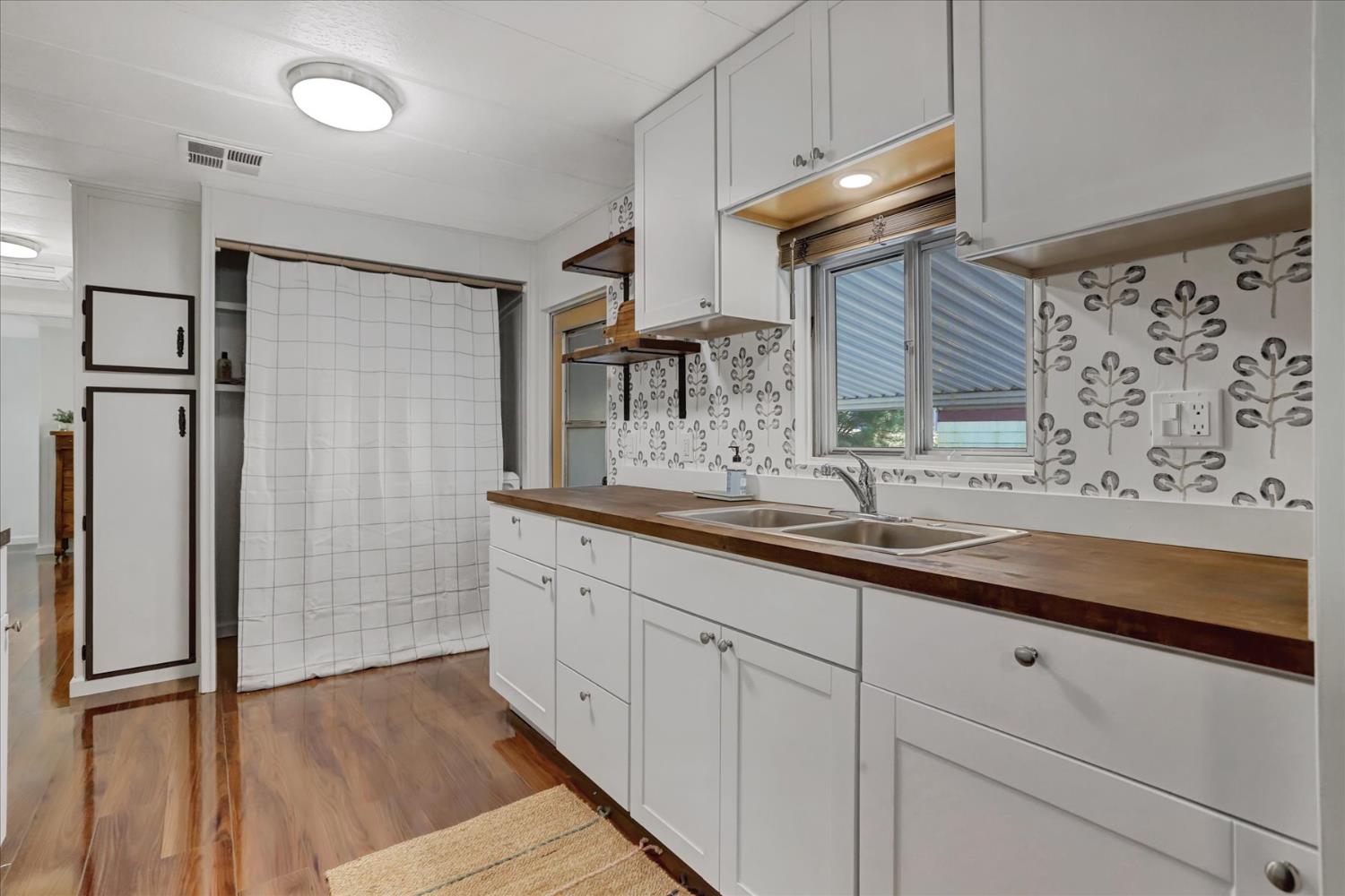 65 Primrose Lane Grass Valley, CA 95945 - Photo 11 of 41 a bathroom with a double vanity sink and a mirror