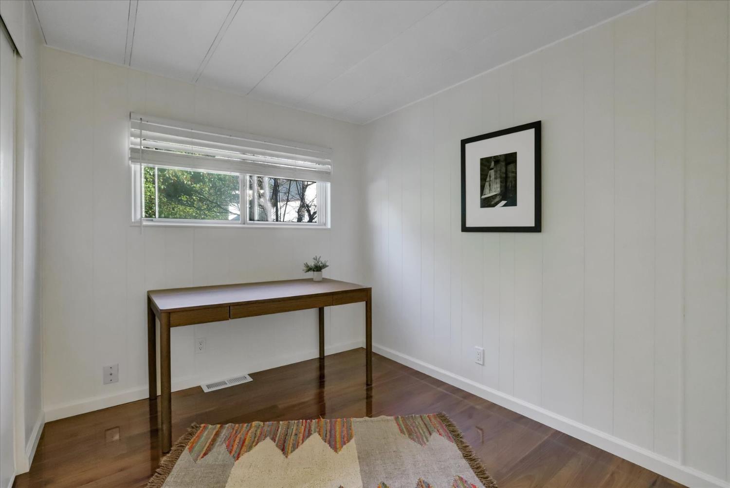 65 Primrose Lane Grass Valley, CA 95945 - Photo 15 of 41 a room with a window and a painting on the wall