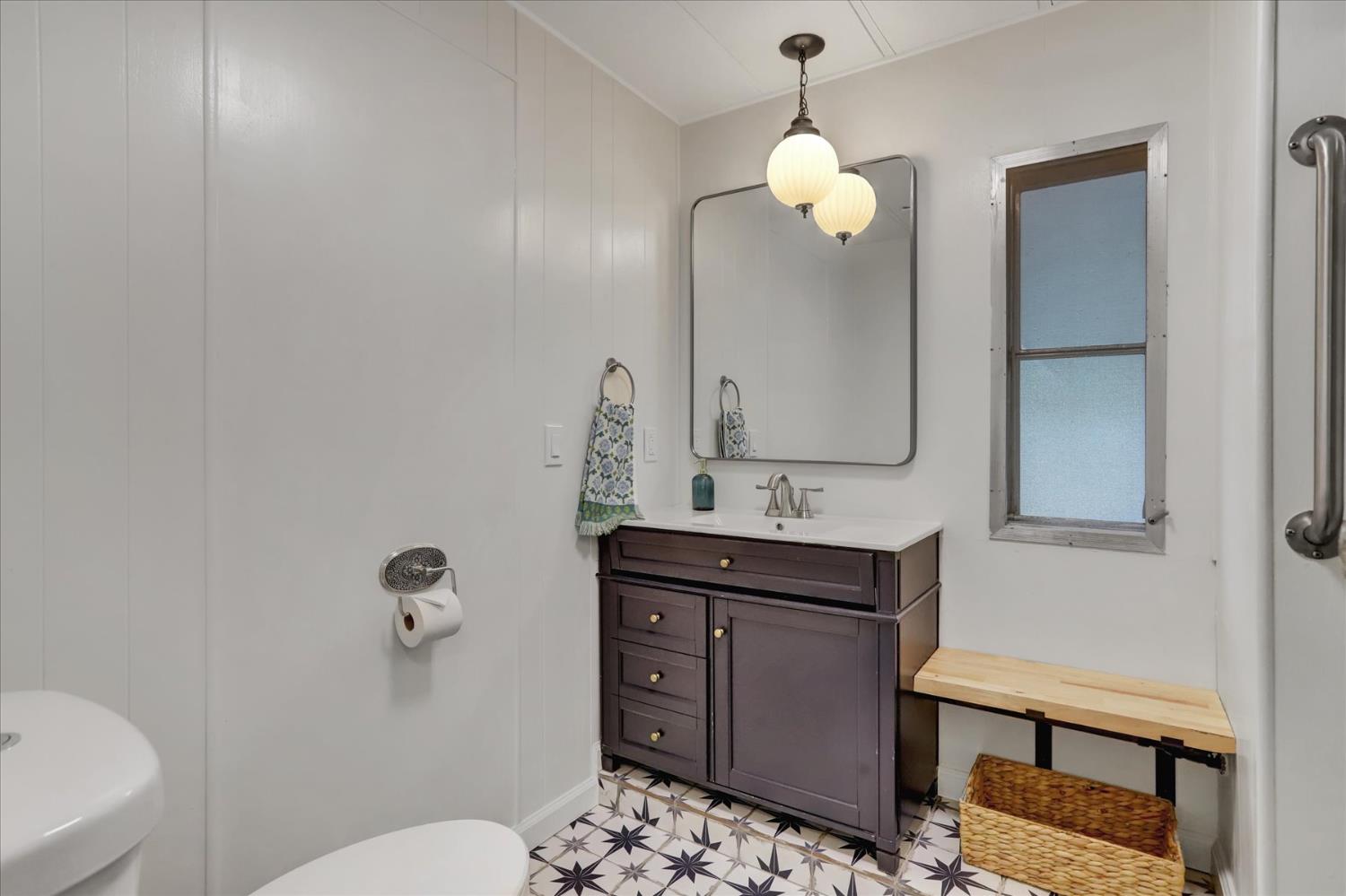 65 Primrose Lane Grass Valley, CA 95945 - Photo 18 of 41 a bathroom with a sink a toilet and mirror
