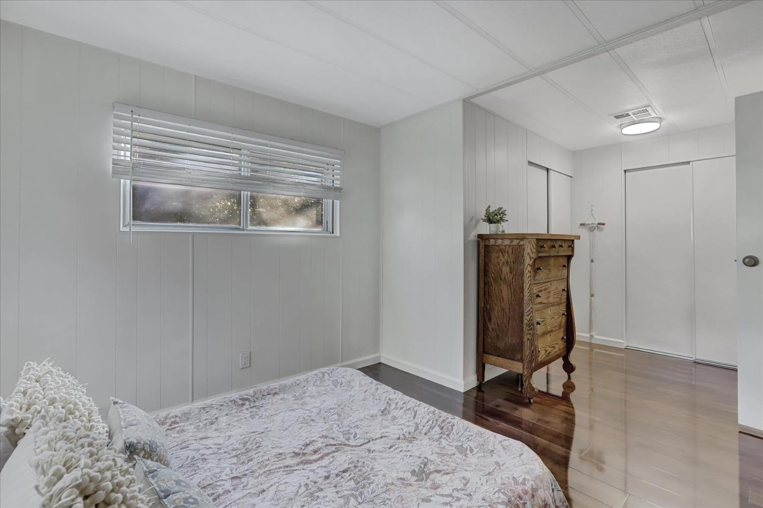 65 Primrose Lane Grass Valley, CA 95945 - Photo 21 of 41 a bedroom with a bed and a window