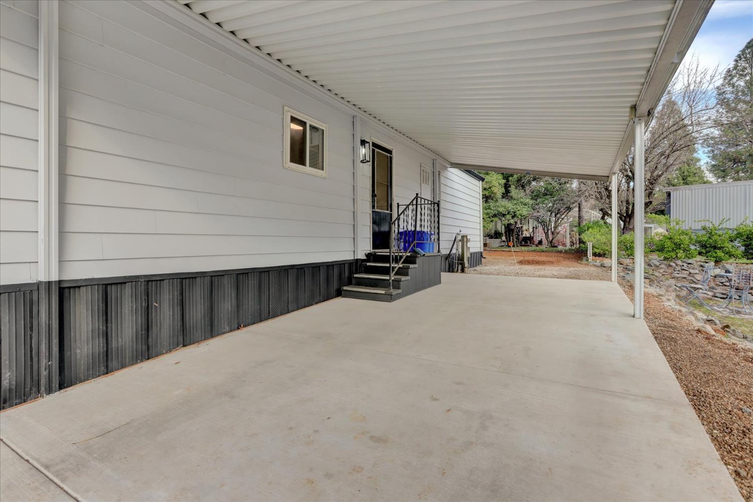 65 Primrose Lane Grass Valley, CA 95945 - Photo 27 of 41 a view of a street with wooden fence