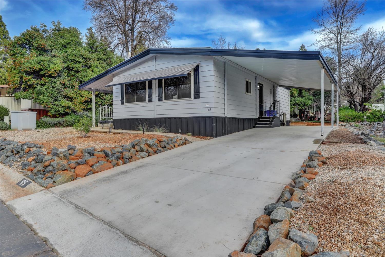65 Primrose Lane Grass Valley, CA 95945 - Photo 30 of 41 a front view of a house with garden