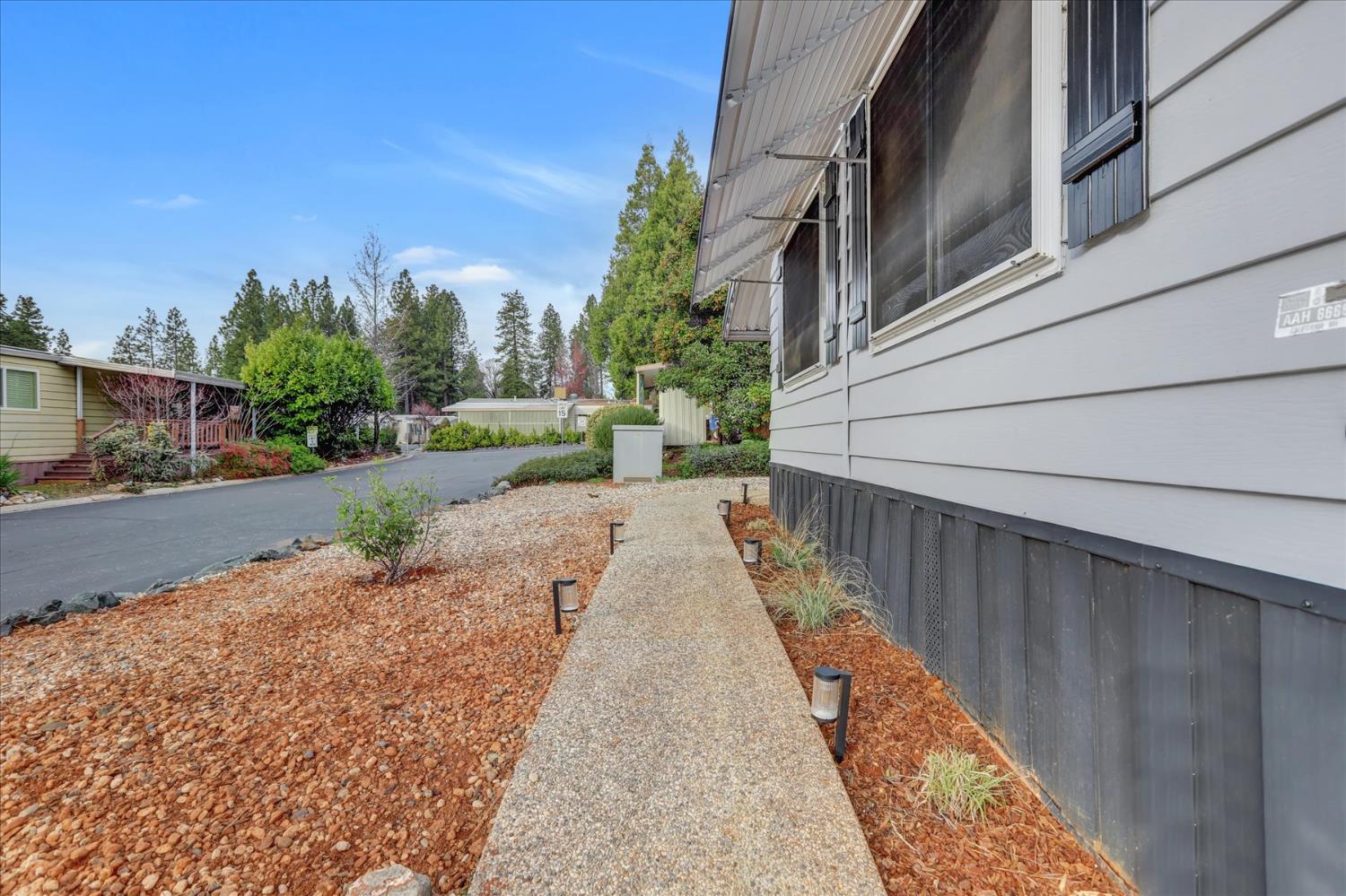 65 Primrose Lane Grass Valley, CA 95945 - Photo 32 of 41 a view of a street with cars on street side