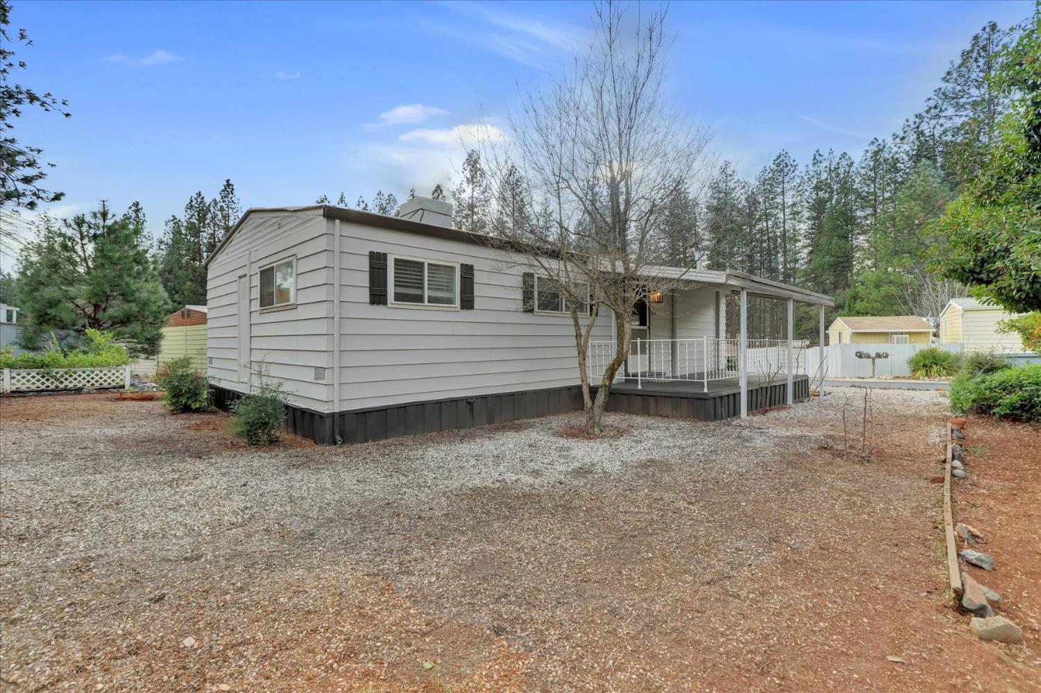 65 Primrose Lane Grass Valley, CA 95945 - Photo 36 of 41 a front view of a house with a yard