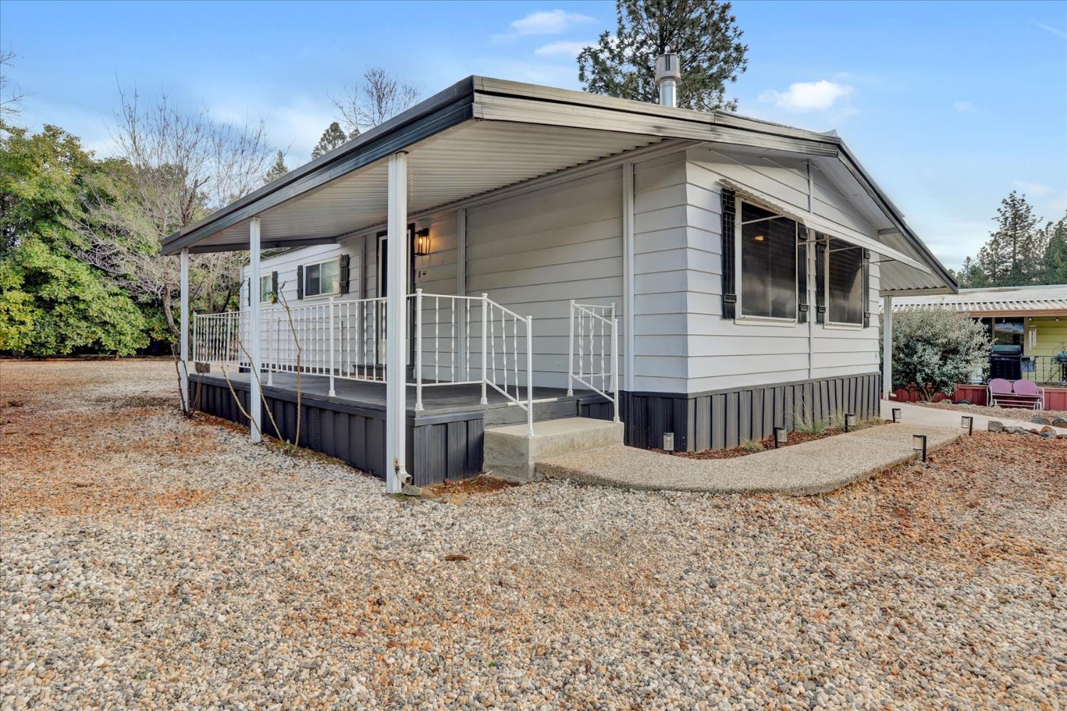 65 Primrose Lane Grass Valley, CA 95945 - Photo 37 of 41 a view of a house with wooden fence