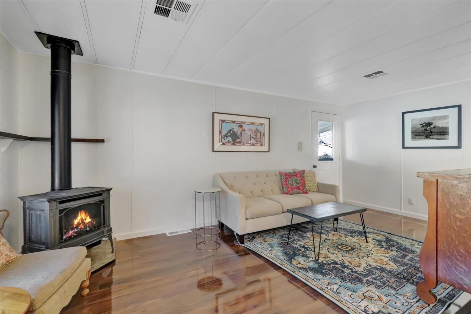 65 Primrose Lane Grass Valley, CA 95945 - Photo 5 of 41 a living room with furniture and a fireplace