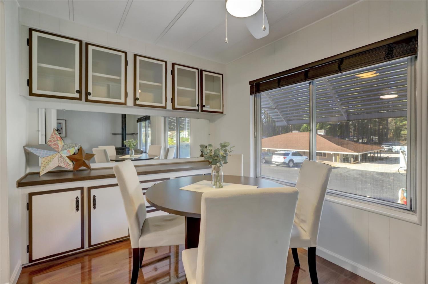 65 Primrose Lane Grass Valley, CA 95945 - Photo 8 of 41 a kitchen with a table chairs sink and cabinets
