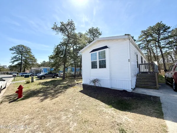 a view of a backyard of the house