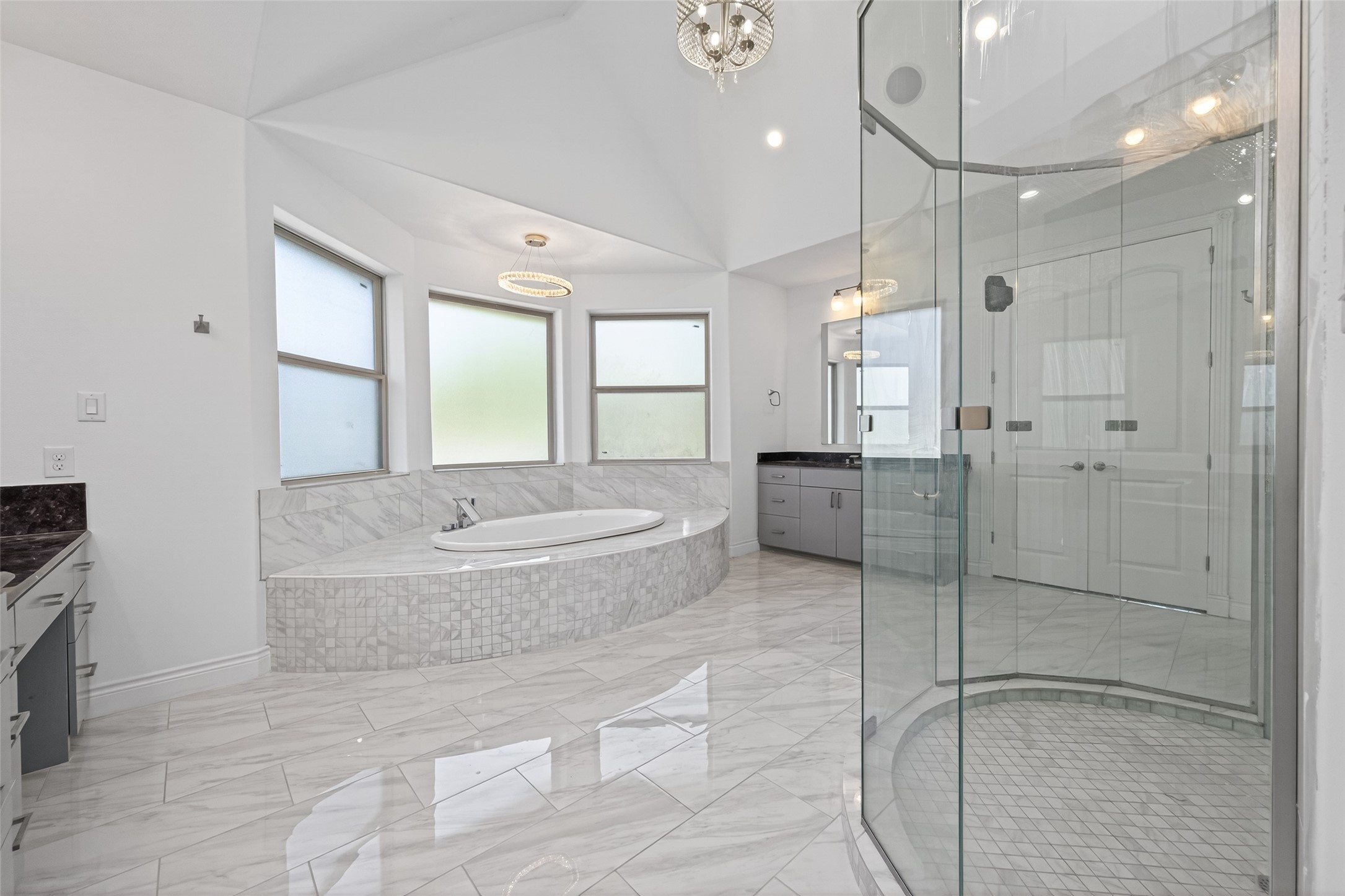 2504 Southline Road Conroe, TX 77384 - Photo 14 of 26 a spacious bathroom with a granite countertop sink a toilet a mirror and shower