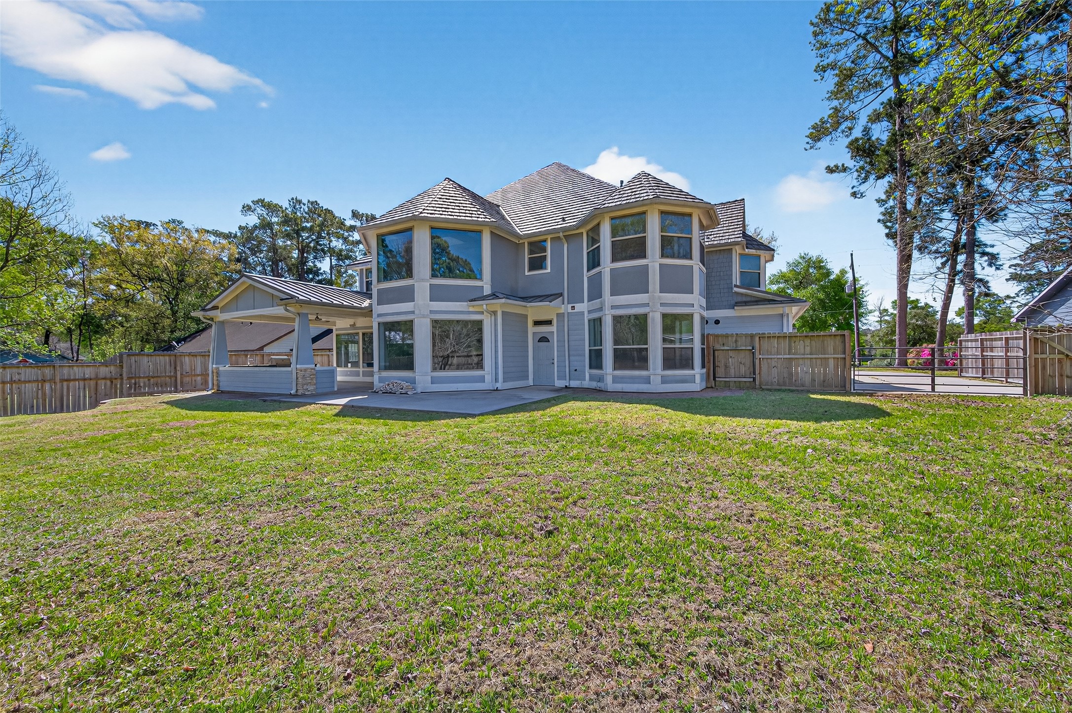 2504 Southline Road Conroe, TX 77384 - Photo 23 of 26 a front view of a house with a garden
