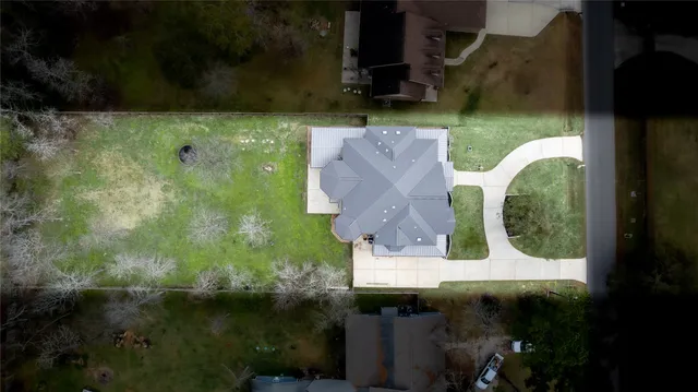 an aerial view of residential house with outdoor space