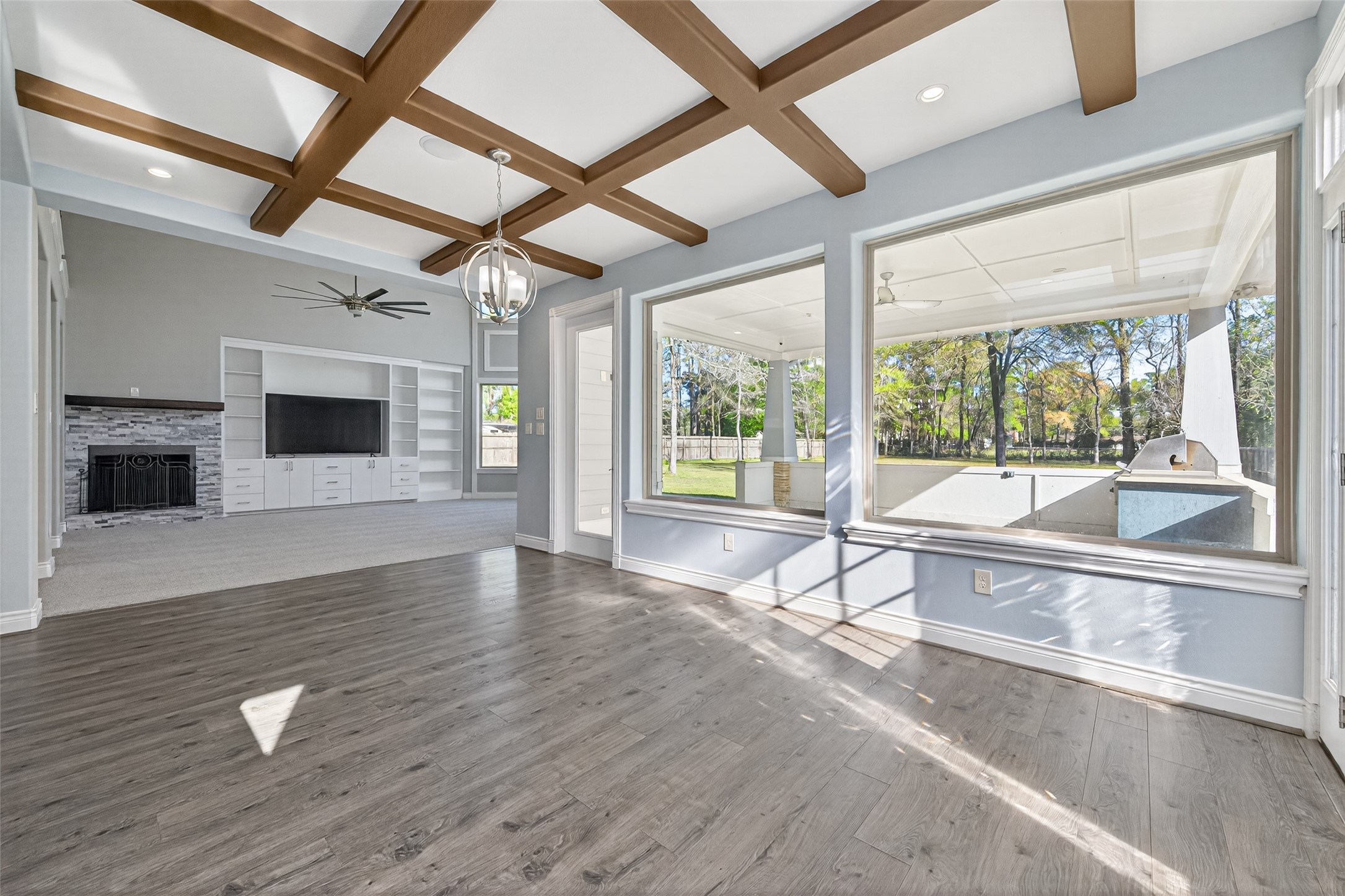 2504 Southline Road Conroe, TX 77384 - Photo 6 of 26 a view of an empty room with wooden floor and a window