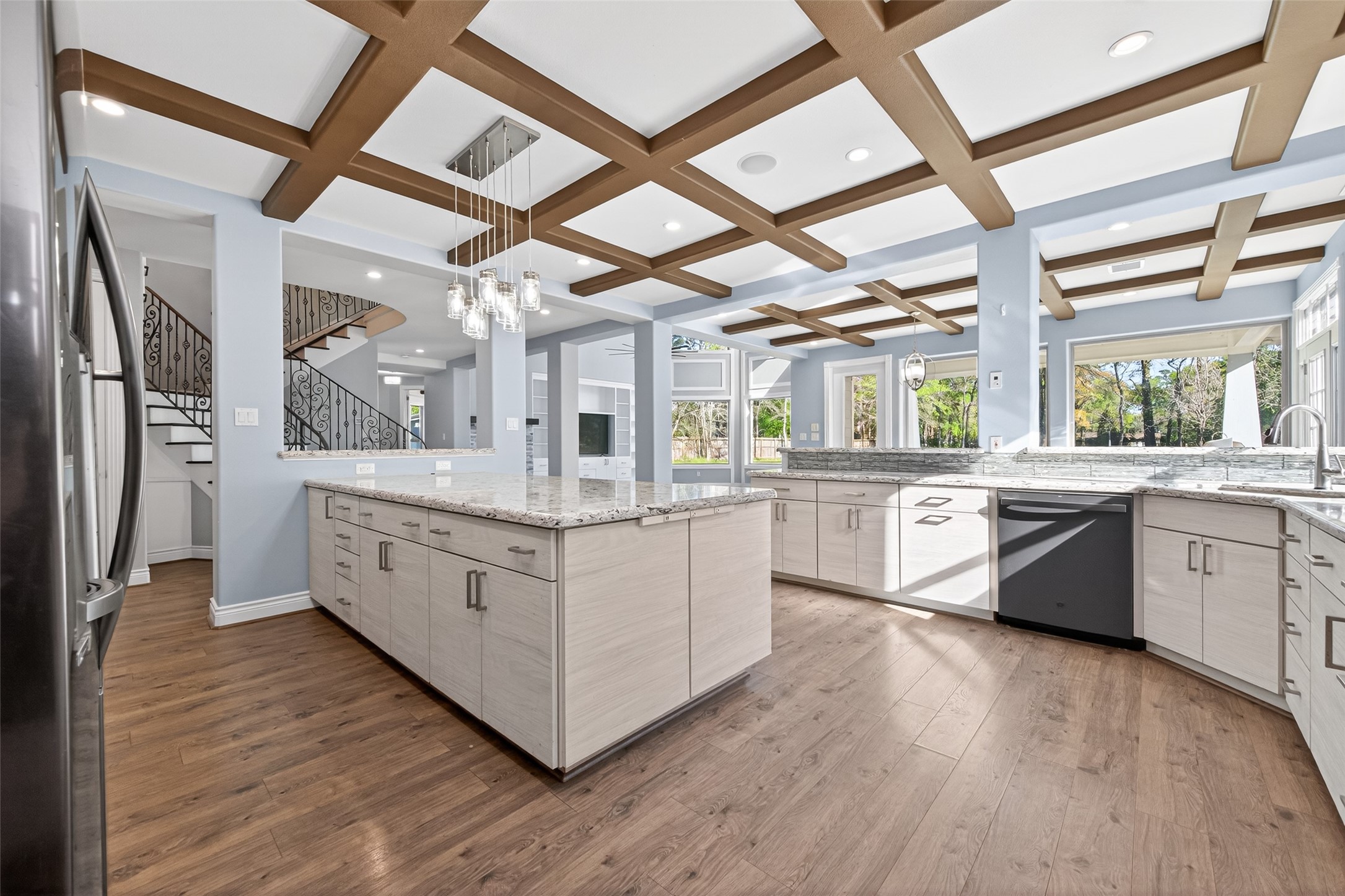 2504 Southline Road Conroe, TX 77384 - Photo 7 of 26 a kitchen with stainless steel appliances double cabinets and a large window