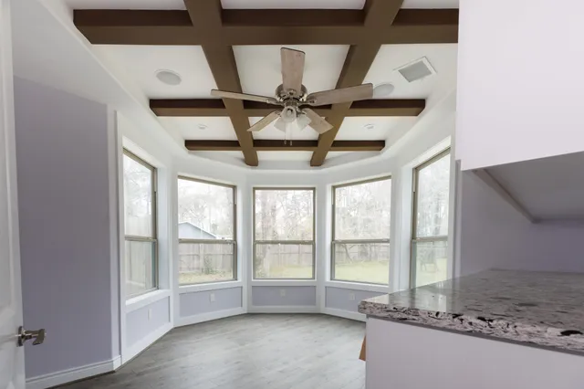 a view of room with a ceiling fan
