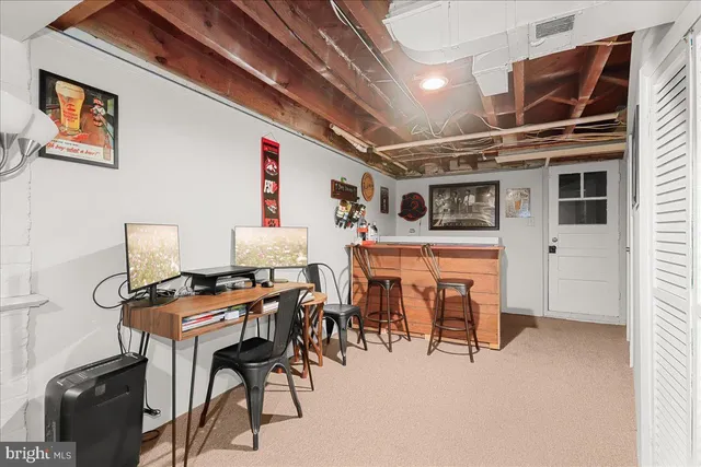 a work room with furniture and a window