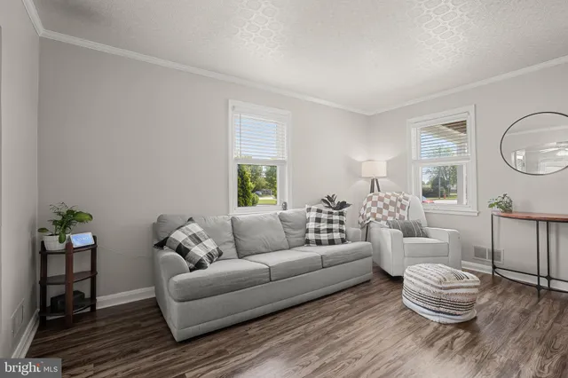 a living room with furniture and a table