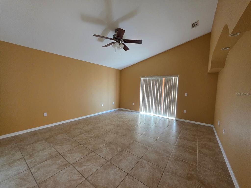 4532 Great Blue Heron Drive Lakeland, FL 33812 - Photo 12 of 33 a view of an empty room with wooden floor