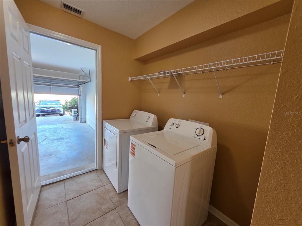 4532 Great Blue Heron Drive Lakeland, FL 33812 - Photo 17 of 33 a utility room with dryer and washer