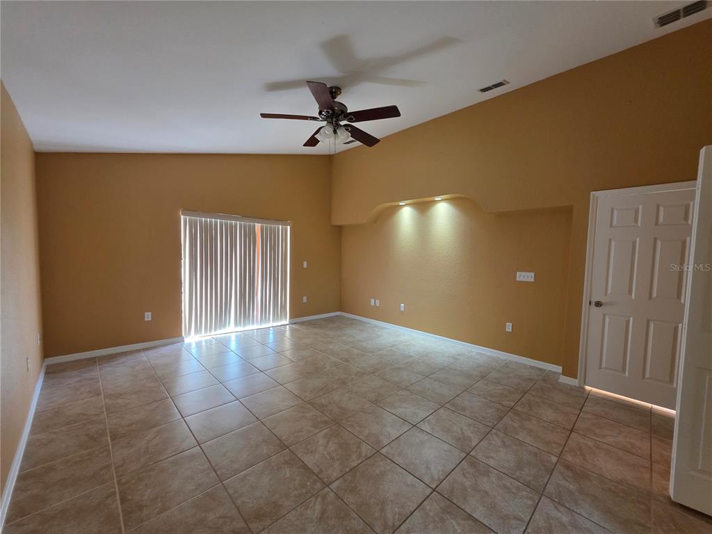 4532 Great Blue Heron Drive Lakeland, FL 33812 - Photo 18 of 33 a view of an empty room with a ceiling fan