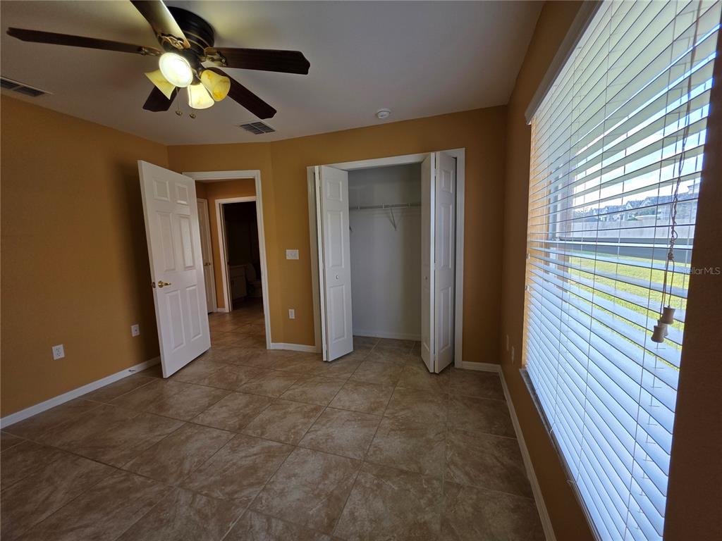 4532 Great Blue Heron Drive Lakeland, FL 33812 - Photo 30 of 33 wooden floor in an empty room with a window