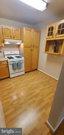 a view of kitchen and wooden floor