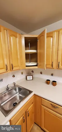 a kitchen with a sink and a window