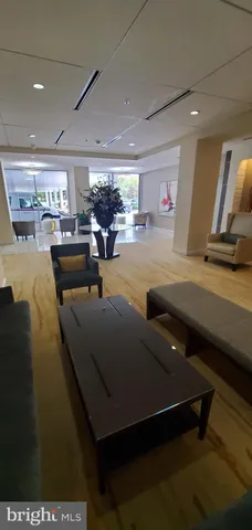 a room with furniture pool table and a flat screen tv