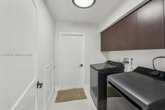 a bathroom with a tub a toilet and a window