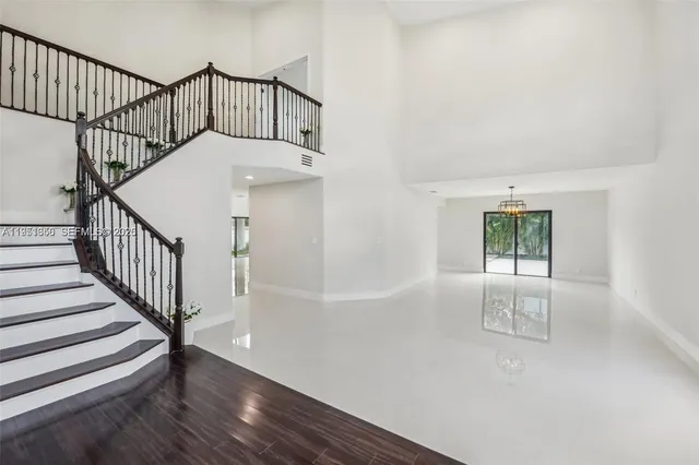 a bathroom with a double vanity sink toilet and mirror