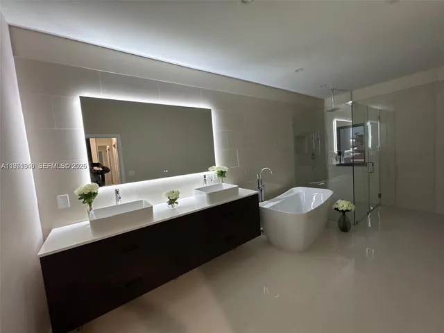 a view of a room with wooden floor carpet and a window